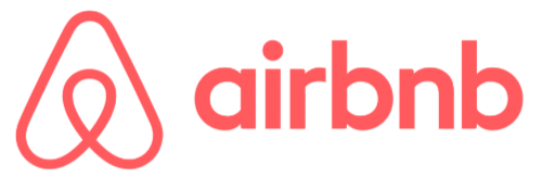 Airbnb logo with a red abstract symbol resembling a heart and a location pin, next to the word "airbnb" in lowercase red letters—perfect for Vacation Rental Blogs seeking an eye-catching brand image.
