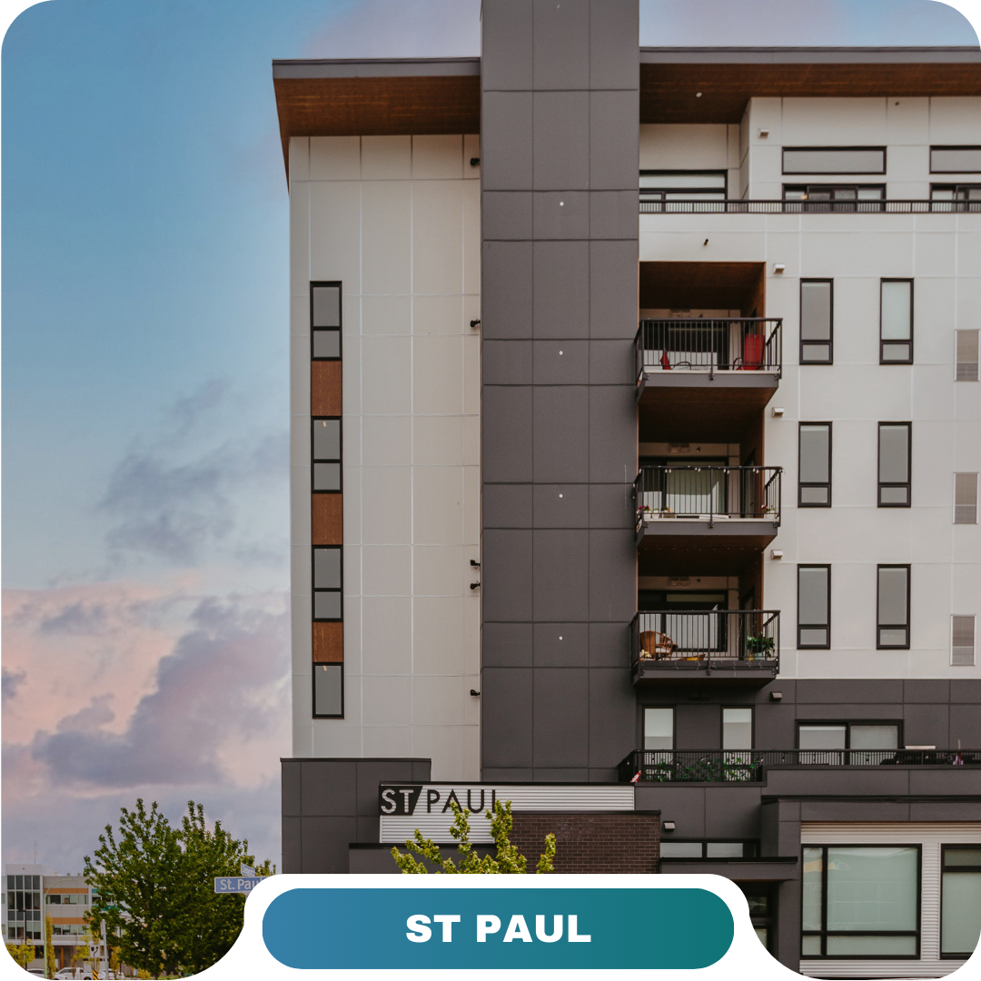 Modern apartment building with balconies and the sign "ST PAUL" on the lower facade, set against a partly cloudy sky at dusk—an inviting option for vacation rentals in Big White.